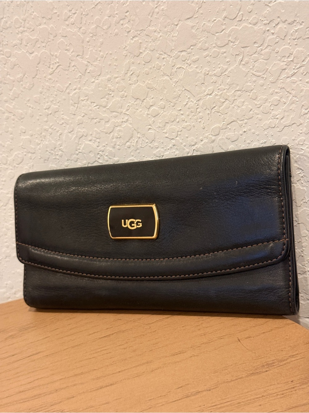 UGG Black Leather Foldover Wallet with Gold Logo